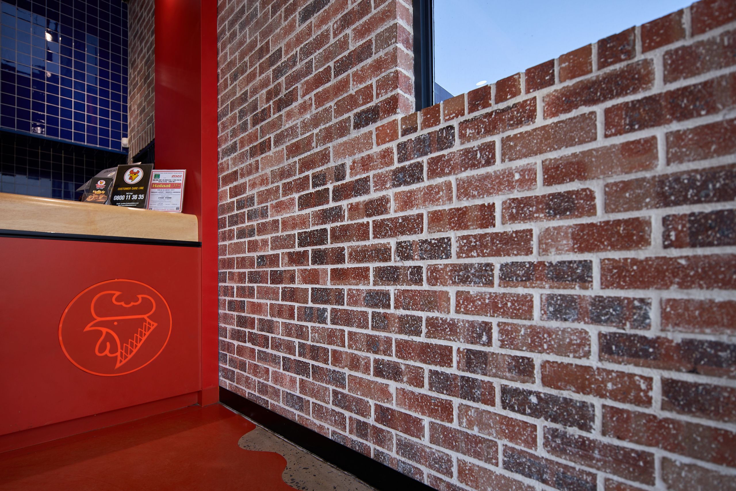New Look Chicken Licken by Boogertman and Partners_featuring Corobrik Nevada Travertine with a rustic German Schmear effect