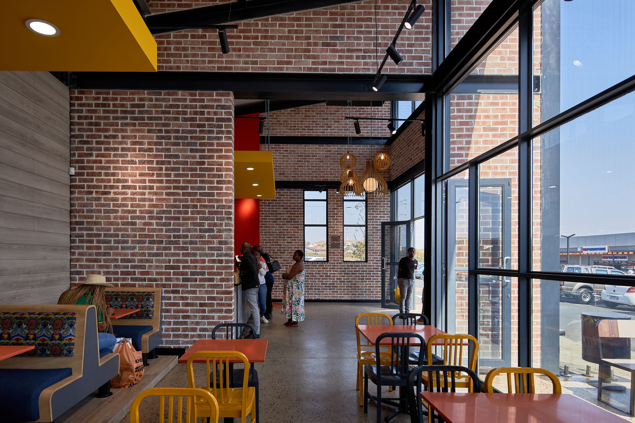New Look Chicken Licken by Boogertman and Partners_featuring Corobrik Nevada Travertine with a rustic German Schmear effect