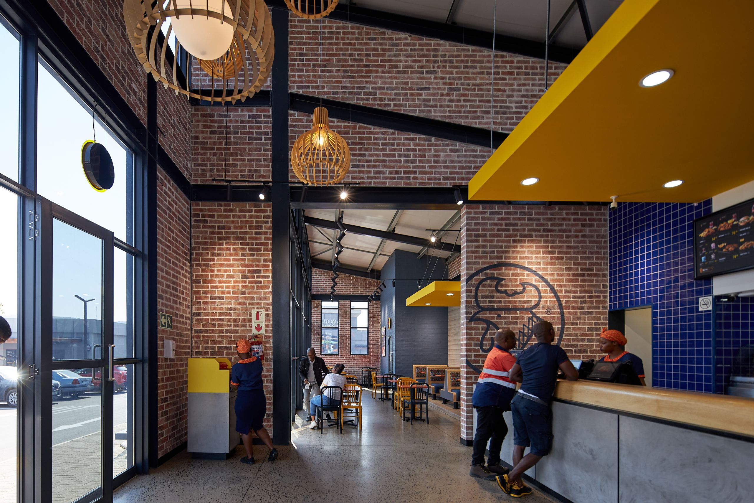 New Look Chicken Licken by Boogertman and Partners_featuring Corobrik Nevada Travertine with a rustic German Schmear effect